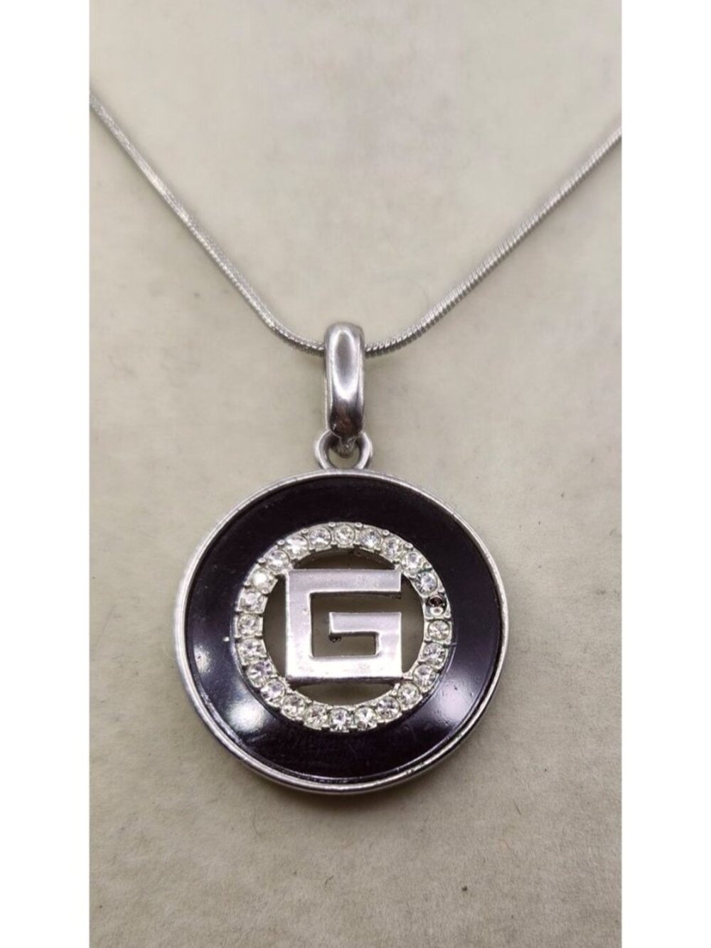 Silver-Tone "G" Pendant Necklace With Rhinestone Accents & Black Enamel Design